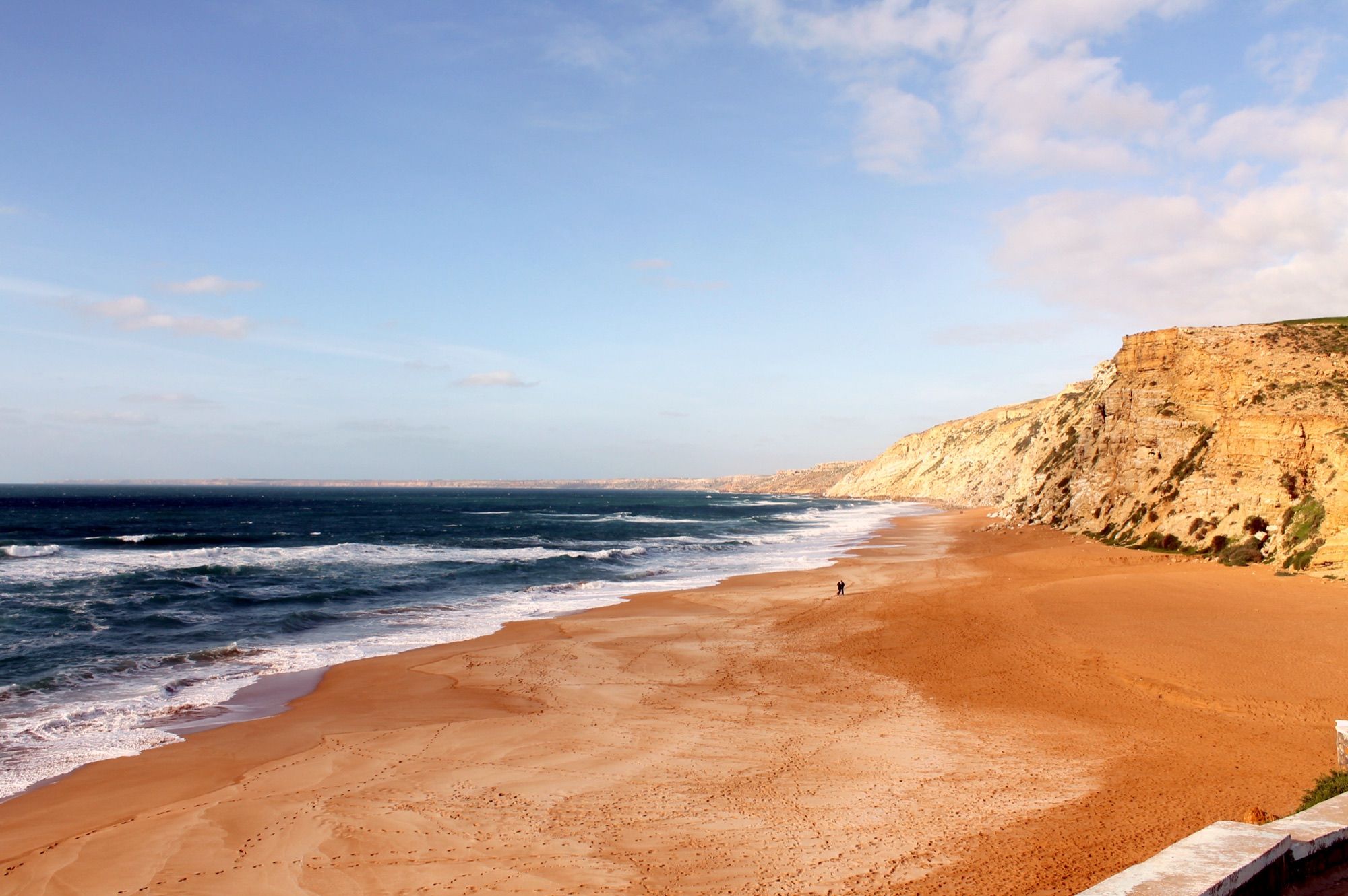 Lalla Fatna beach below its ochre cliffs
